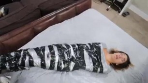 Guy Wraps Girlfriend in Duct Tape like a Mummy